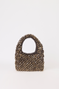 A small structured handbag covered in metallic gold studs on a dark brown base, featuring a single top handle, photographed against a plain white background.
