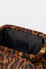 [color:cheetah] Close-up of a leopard-print pouch or clutch showing the interior black lining with a black BTE London logo patch and a gold zipper pull.