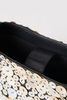 [color:black] Close-up of a black leather clutch bag decorated with large white and beige circular shell-like embellishments on the front, showing the black interior lining.