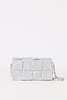 [COLOR: SILVER] A silver woven clutch bag with a textured basketweave pattern and a silver chain strap, shown against a plain white background.