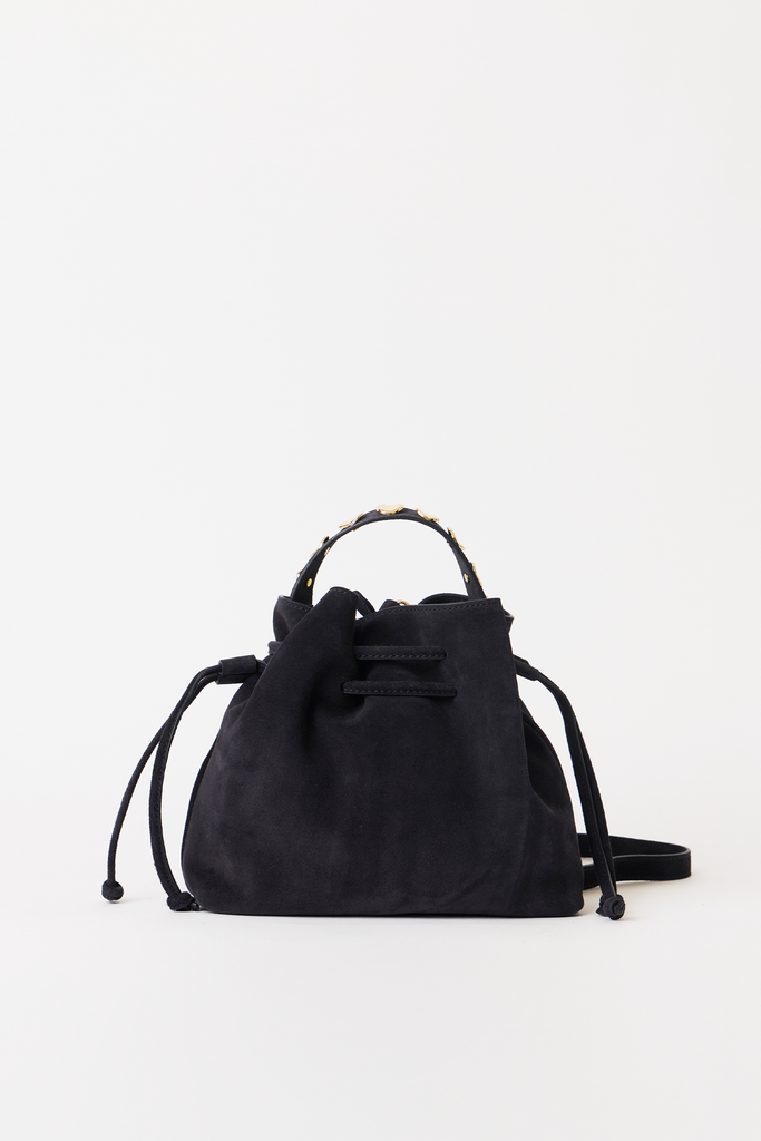 [color: navy suede] A black suede bucket bag with a top handle and shoulder strap, photographed against a plain white background.