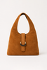 [color: whiskey suede] A camel brown suede hobo bag with a braided leather strap detail and a dark metal C-shaped ring, shown on a clean white background.
