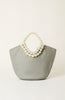 A light gray fabric tote bag with a double-strand pearl handle, photographed against a clean, off-white background.