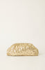 A gold metallic clutch purse with a textured, crinkled surface and small rhinestone embellishments, set against a plain off-white background.