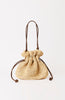 Beige woven drawstring bag on a white background