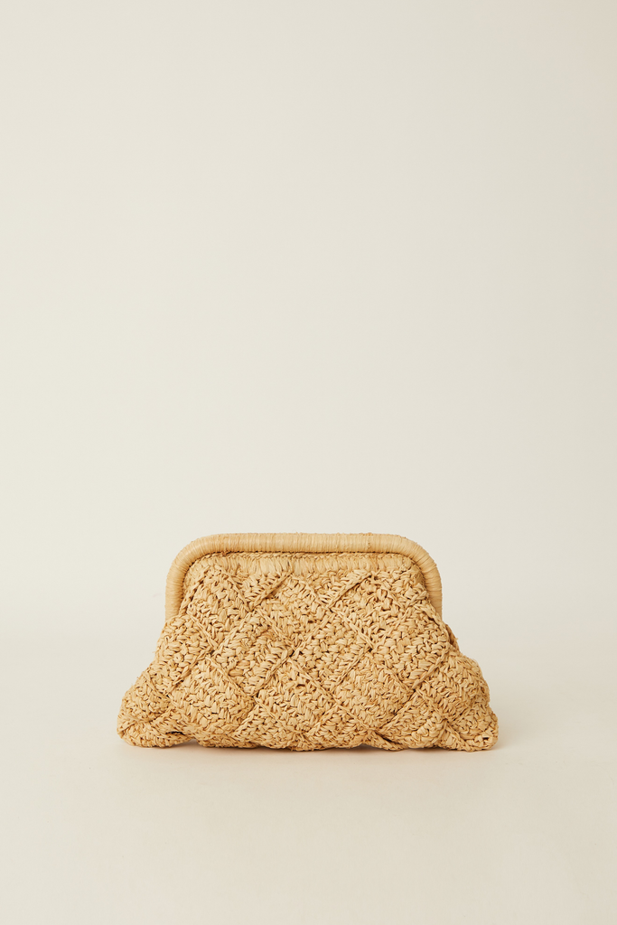A small woven straw clutch bag with a diamond-patterned texture and a light tan metal clasp frame, set against a solid off-white background.