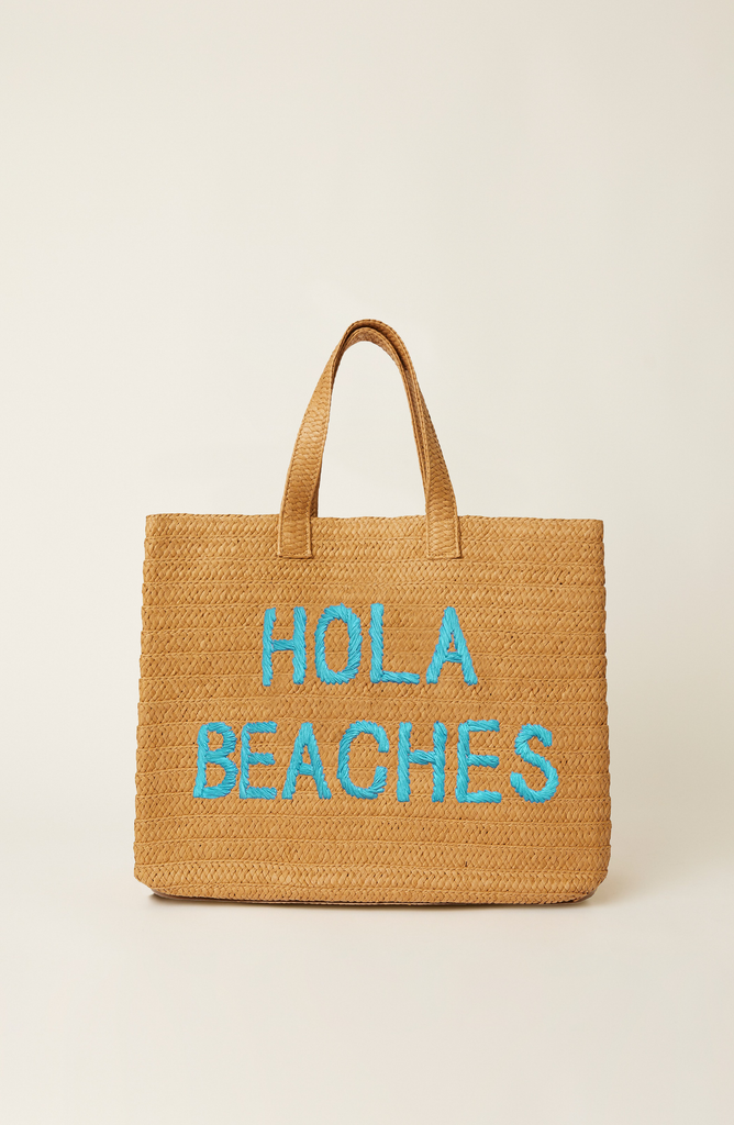 Woven bag with 'Hola Beaches' text on a beige background