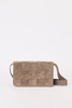 [color:stone suede] A taupe woven leather shoulder bag with a grid pattern and a matching adjustable strap, shown against a plain white background.